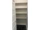 Small pantry area with open shelving for organized storage at 211 W 2Nd St, Kershaw, SC 29067