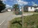 A street with other houses around and a mailbox that reads '211' at 211 W 2Nd St, Kershaw, SC 29067