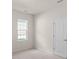 Bedroom with carpet, a window with blinds, base trim, and a white door at 2136 Ashley River Rd, Waxhaw, NC 28173