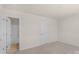 This bedroom has neutral carpet, fresh paint, and a door to the bathroom at 2136 Ashley River Rd, Waxhaw, NC 28173