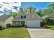 Charming home featuring a manicured lawn, lovely landscaping, and a two-car garage at 2136 Ashley River Rd, Waxhaw, NC 28173