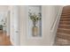 Hallway with decorative niche and staircase leading to the upper level at 2136 Ashley River Rd, Waxhaw, NC 28173