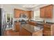 Kitchen with stainless steel appliances, granite countertops, a center island, and wood cabinetry at 2136 Ashley River Rd, Waxhaw, NC 28173