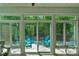 Beautiful sunroom and patio area complete with blue outdoor furniture at 2136 Ashley River Rd, Waxhaw, NC 28173