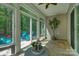 Bright sunroom with tile floor, ceiling fan, and views of the backyard at 2136 Ashley River Rd, Waxhaw, NC 28173