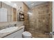 Modern bathroom with tiled shower, granite countertop sink, and contemporary fixtures at 214 Creek View Rd, Mooresville, NC 28117