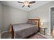 Simple bedroom with a bed, nightstand, and overhead ceiling fan at 214 Creek View Rd, Mooresville, NC 28117