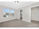 Spacious bedroom featuring bright, sunlit windows and soft neutral carpeting at 218 Lacewing Dr # 41, Charlotte, NC 28214