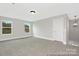 Versatile bonus room with lots of windows providing natural light and neutral carpeting at 218 Lacewing Dr # 41, Charlotte, NC 28214