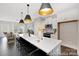 Open-concept kitchen with stainless steel appliances, a long island with seating, and a view into the living room at 218 Lacewing Dr # 41, Charlotte, NC 28214