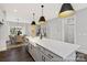 Beautiful kitchen with large island, farm sink, stainless steel appliances, and open layout to the dining area at 218 Lacewing Dr # 41, Charlotte, NC 28214
