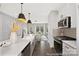 Bright, well-appointed kitchen with stainless steel appliances, stone countertops, and an open view to the living area at 218 Lacewing Dr # 41, Charlotte, NC 28214