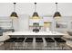 Modern kitchen featuring a large island with bar seating, pendant lighting, white cabinets, and stainless steel appliances at 218 Lacewing Dr # 41, Charlotte, NC 28214