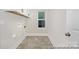 Functional laundry room with tiled floors, modern fixtures, and ample space at 218 Lacewing Dr # 41, Charlotte, NC 28214