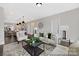 Spacious living room with open floor plan, stylish furnishings, and seamless flow to the dining and kitchen areas at 218 Lacewing Dr # 41, Charlotte, NC 28214