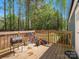 Inviting back deck with grill and bicycles, surrounded by lush green trees at 2234 Emerald Mine Rd, Shelby, NC 28152
