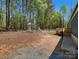 Spacious backyard with a swing set, basketball hoop, and a wooden deck with a grill at 2234 Emerald Mine Rd, Shelby, NC 28152