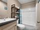 Bathroom featuring vanity with white sink and updated bath tub with shower head at 2234 Emerald Mine Rd, Shelby, NC 28152