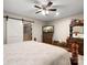 Bedroom boasts a ceiling fan and a large dresser with a TV on top at 2234 Emerald Mine Rd, Shelby, NC 28152