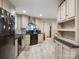 Modern kitchen featuring sleek black appliances, light wood cabinetry, and a stainless steel sink at 2234 Emerald Mine Rd, Shelby, NC 28152