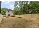 A spacious backyard features a wooden deck, a new fence and ample space for outdoor activities at 2512 Remington St, Charlotte, NC 28216