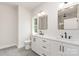 Bathroom with double sinks, modern fixtures, and a walk-in shower, designed for comfort and functionality at 2512 Remington St, Charlotte, NC 28216