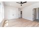Spacious bedroom featuring hardwood floors, three closets, and neutral walls for versatile decorating at 2512 Remington St, Charlotte, NC 28216