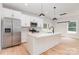 Well-appointed kitchen boasts stainless steel appliances, a center island, and sleek modern finishes at 2512 Remington St, Charlotte, NC 28216