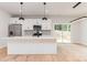 Stylish kitchen with stainless steel appliances, an island, and direct access to the outdoor deck at 2512 Remington St, Charlotte, NC 28216