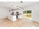 Contemporary kitchen featuring an island, stainless appliances, and a seamless transition to the outdoor patio at 2512 Remington St, Charlotte, NC 28216