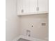 Laundry room showcasing white cabinets, modern fixtures, and utility hookups at 2512 Remington St, Charlotte, NC 28216