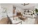 Bright living room featuring light wood floors, modern furnishings, and an open floor plan leading to the kitchen at 2512 Remington St, Charlotte, NC 28216