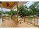 Inviting front porch with natural wood, a ceiling fan, and an open view, perfect for relaxation and entertaining at 2512 Remington St, Charlotte, NC 28216
