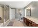 Bright bathroom featuring double vanity, walk-in shower, and exercise equipment at 2532 Annecy Dr, Matthews, NC 28105