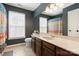 Well-lit bathroom featuring a single sink vanity with a dark wall paint at 2532 Annecy Dr, Matthews, NC 28105