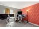 Bedroom with a unique 3D red accent wall and an office space at 2532 Annecy Dr, Matthews, NC 28105