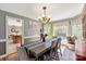 Cozy dining room with a wooden table, view of pool, and an inviting atmosphere for meals and entertaining at 2532 Annecy Dr, Matthews, NC 28105