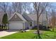 Charming single-story home with a manicured lawn, attached garage, and classic architectural details at 2532 Annecy Dr, Matthews, NC 28105