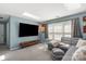 Comfortable living room with a skylight, TV and a gray sectional at 2532 Annecy Dr, Matthews, NC 28105