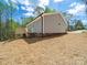 Back exterior with small deck and siding for a low maintenance home that still has classic look and feel at 297 Barr Link Rd, Mount Pleasant, NC 28124