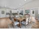 Open dining area featuring a kitchen view, white cabinets and seating for six guests at 297 Barr Link Rd, Mount Pleasant, NC 28124