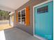 Close up of the front door, showing the porch and window accents at 297 Barr Link Rd, Mount Pleasant, NC 28124