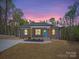 Charming single-story home featuring a light gray exterior, vibrant blue front door, and lovely landscaping at 297 Barr Link Rd, Mount Pleasant, NC 28124