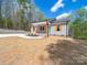 Charming single-story home featuring a light gray exterior, vibrant blue front door, and lovely landscaping at 297 Barr Link Rd, Mount Pleasant, NC 28124