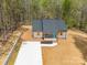 Charming gray home with a modern gray roof, bright blue door, and a spacious new concrete driveway at 297 Barr Link Rd, Mount Pleasant, NC 28124