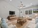 Cozy living room with ample seating, TV, decorative rug and bright natural light at 297 Barr Link Rd, Mount Pleasant, NC 28124