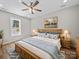 Cozy bedroom featuring wood-framed bed, wood-look flooring, and ample natural light at 297 Barr Link Rd, Mount Pleasant, NC 28124