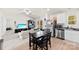 Bright, open-concept living room with a modern kitchen, dining table, and comfortable seating at 3118 Maple Ridge Dr # 11, Gastonia, NC 28052
