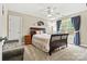 Comfortable bedroom with carpet floors, ceiling fan, and large window with blue drapes at 3207 Oak Ridge Cir, Lincolnton, NC 28092