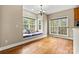 Bright breakfast nook features a window seat, hardwood floors, and a view of the backyard at 3207 Oak Ridge Cir, Lincolnton, NC 28092
